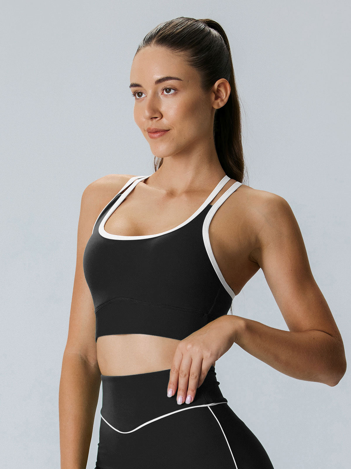 women-knitted-nylon-blended-yoga-sports-bras-black-sustainable-yoga_tops-ztcubi Black X Cross Lycra® Sports Bra - Medium Support - Image 1