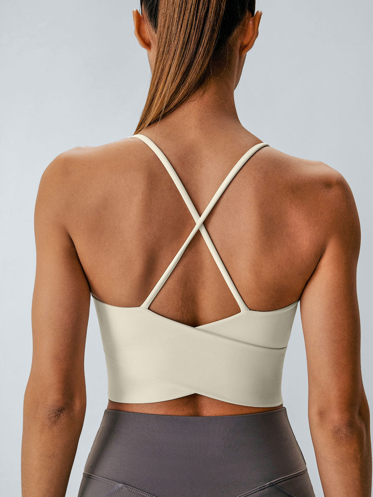 women-knitted-nylon-blended-yoga-sports-bras-sustainable-yoga_tops-dchsmr Cream V Neck X-Cross Sports Bra - Medium Support - Image 1