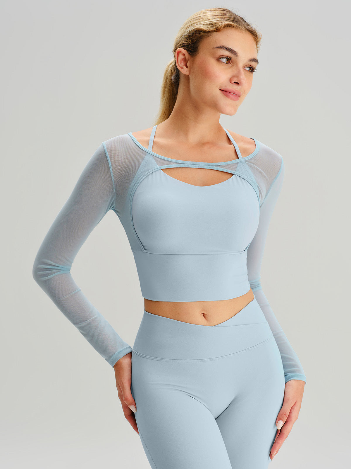 women-knitted-nylon-yoga-long-sleeve-tops-sustainable-yoga_tops-d8uvln Light Blue Cut Out Long Sleeve Top--Light Support - Image 1