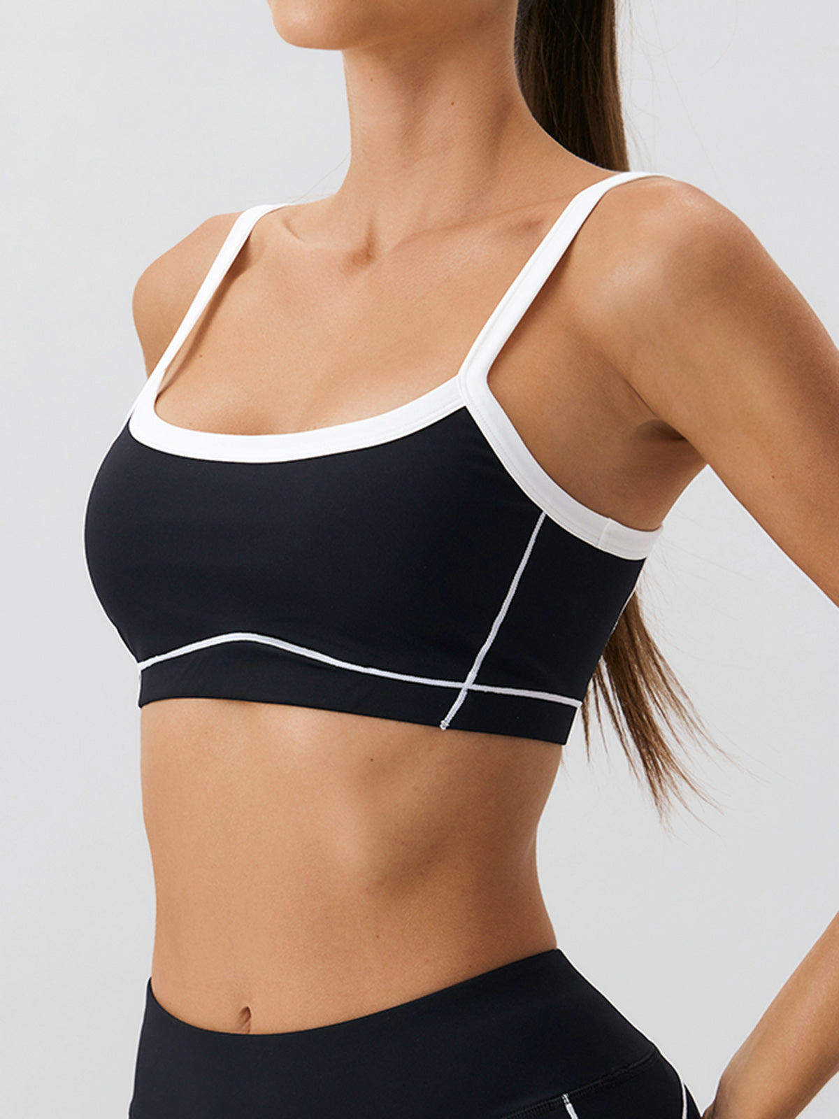women-knitted-nylon-yoga-sports-bras-sustainable-yoga_tops-zuazis Black Contrast Strap Sports Bra - Light Support - Image 1
