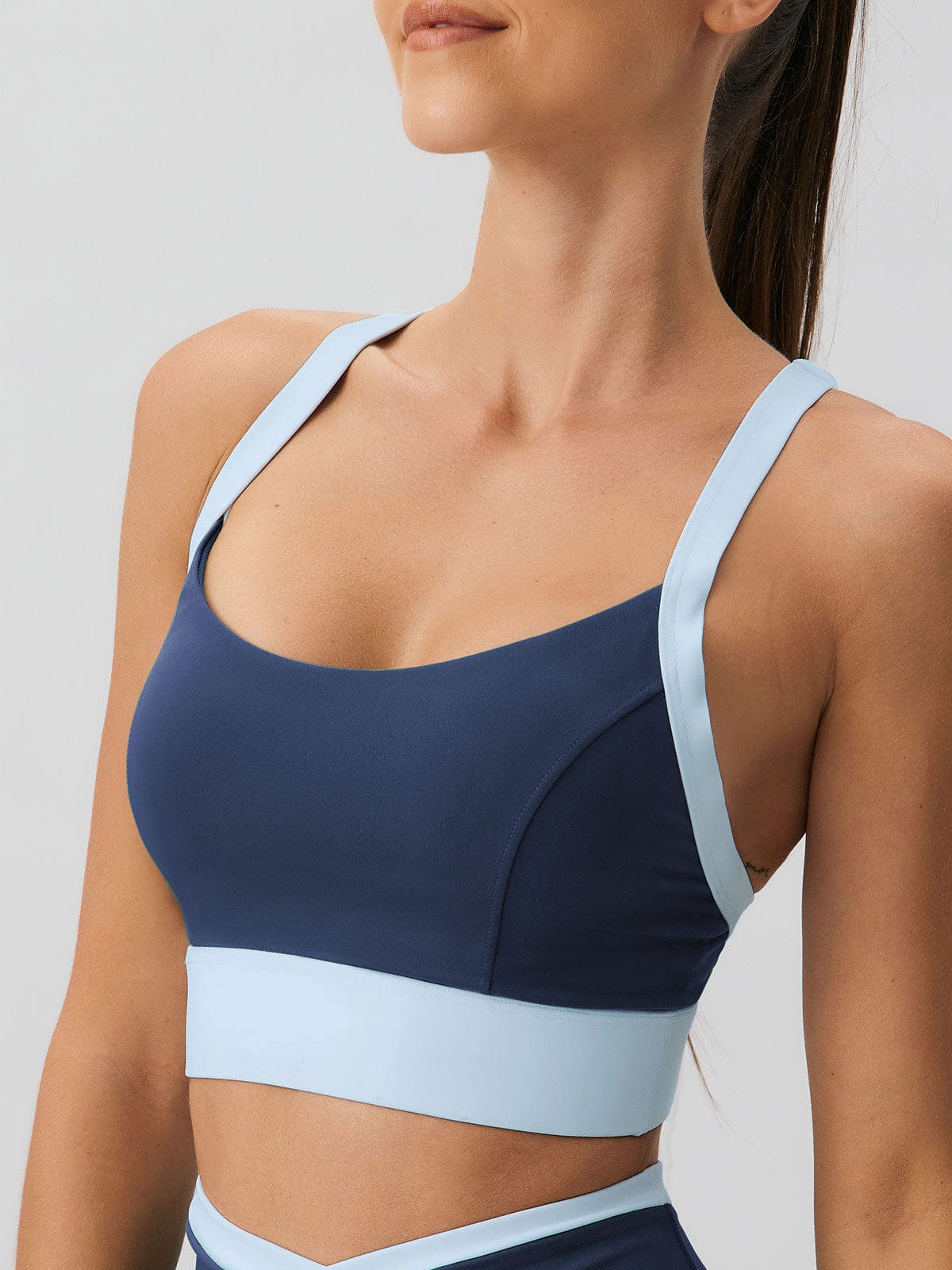 women_-s-knitted-nylon-contrast-color-yoga-sports-bra-navy-sustainable-yoga_tops-1umxo6 Navy Contrast U Neck Sports Bra - Light Support - Image 1