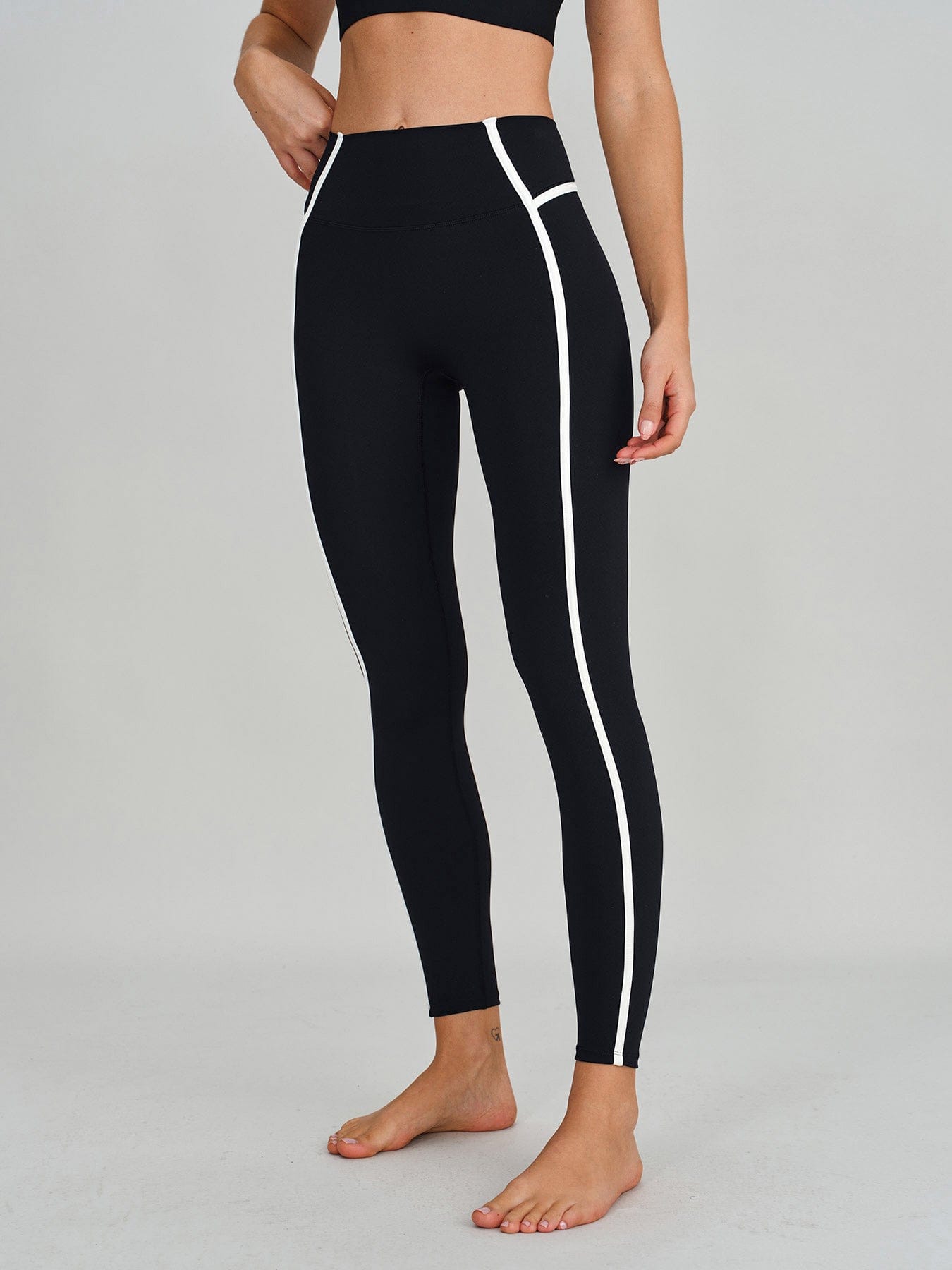 women_s-knitted-nylon-leggings-sustainable-yoga_bottoms-bfl6ru Black High-Waist Side-Stripe Leggings 27" - Image 1