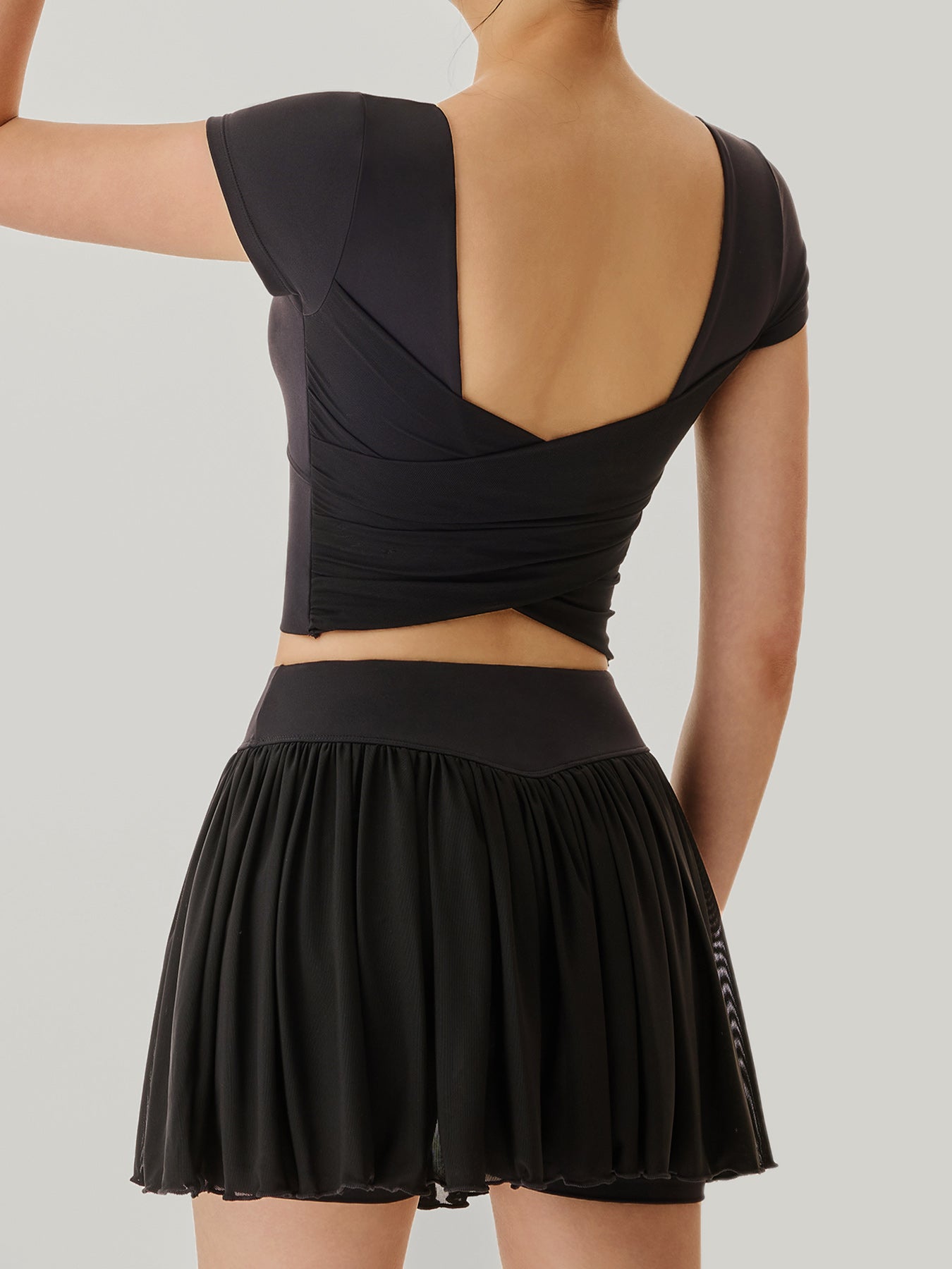 women_s-knitted-nylon-short-sleeve-top-sustainable-yoga_tops-osefek Black Mesh Short Sleeve Top--Light Support - Image 1