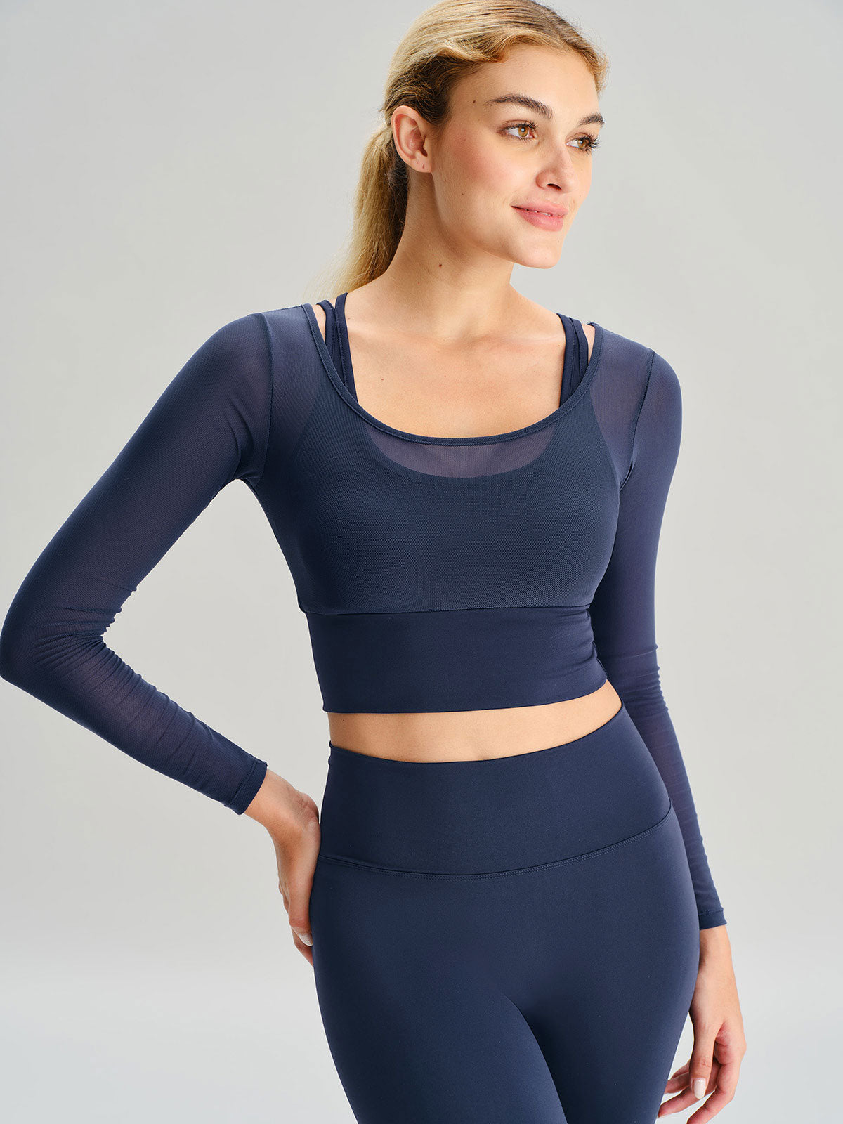 women_s-knitted-nylon-yoga-long-sleeve-top-navy-sustainable-yoga_tops-5sxqe6 Navy U Neck Long Sleeve Top - Light Support - Image 1